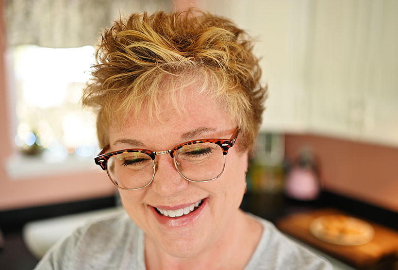 portrait of the author in her kitchen