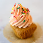 cupcake frosted with high swirl and sprinkles