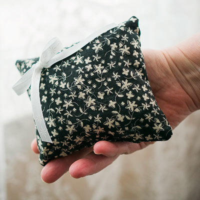 hand holding floral sachet