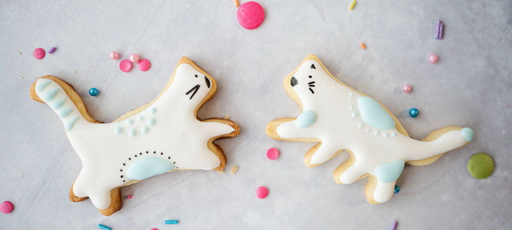 decorated cookies that look like dancing cats