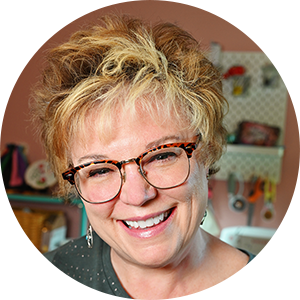 smiling woman in a sewing room. a portrait of the author, Pattymac