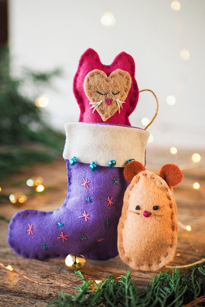 Handstitched toy kitten and mouse with a Christmas stocking