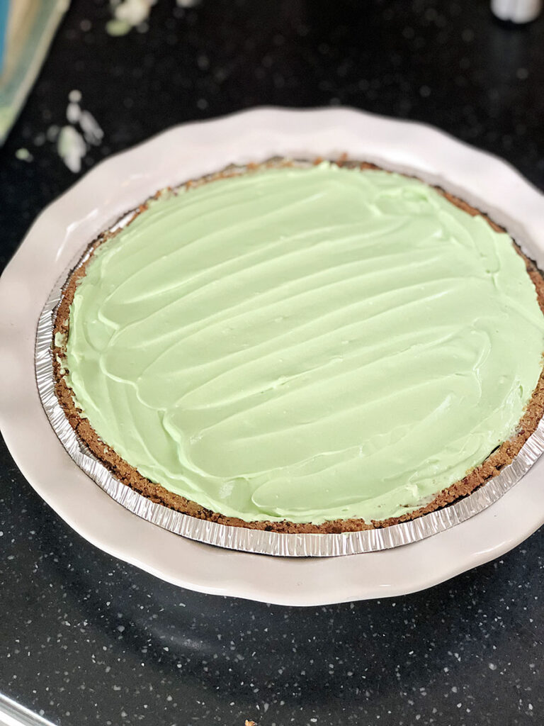 key lime cheesecake pie ready to be refrigerated