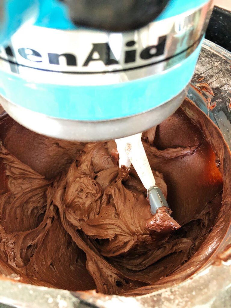Chocolate cake mix batter in the bowl of a stand mixer