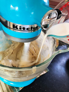 pouring buttermilk into the mixer