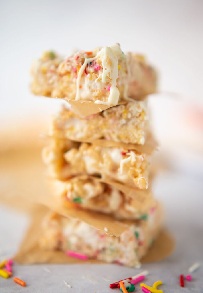 stack of cut rice krispies treats with colorful sprinkles