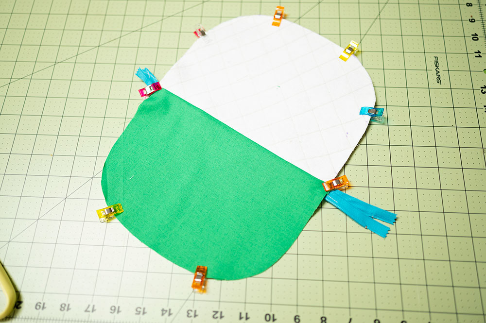the pieces of the quilted zipper pouch project is clipped together, right sides together and ready to be sewn together