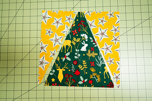 triangles of fabric subcut for piecing into a tree quilt block
