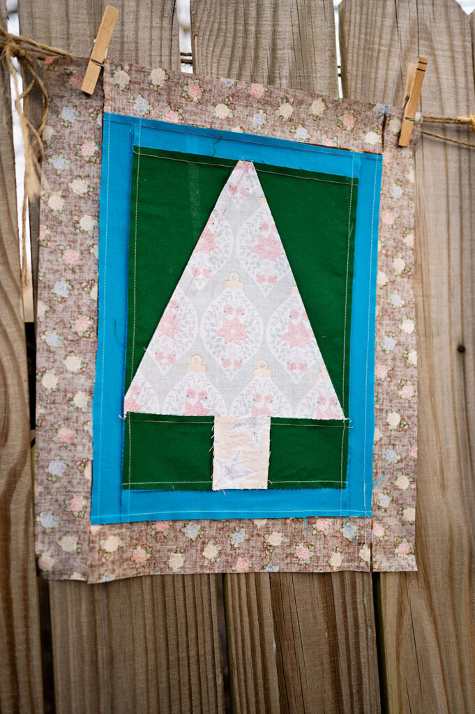 wrong side view of the Christmas tree quilt block showing the direction of the seams