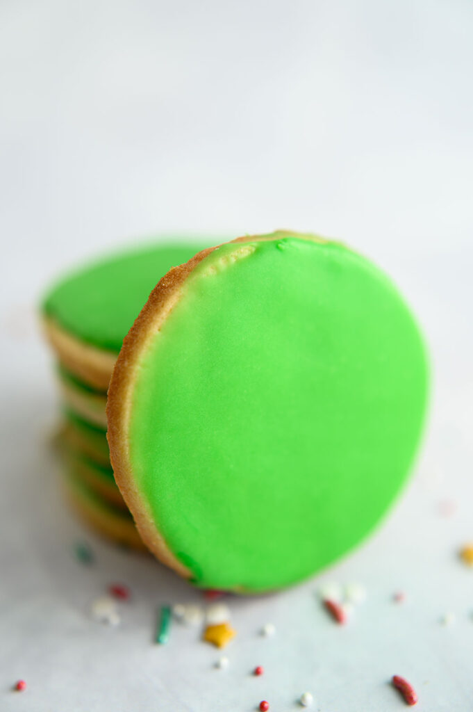 round sugar cookies with soft green glaze