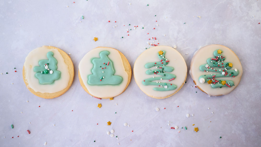 4 cookies lined up showing stages of getting green icing right for decorations