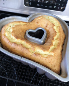 overhead view of a freshly baked cake in a heart shaped pan