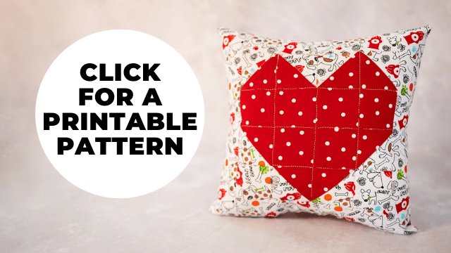 quilted heart pillow with a red heart and a bubble that says to click on it for a printable pattern