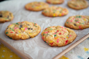 Baked cookies cooling on a sheet pan