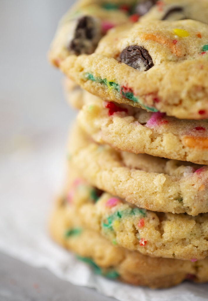 Closeup view of a cookie stack of chocolate chip cookies filled with colorful sprinkles