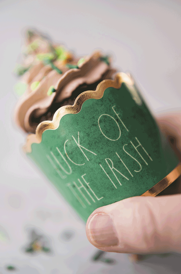 Animated gif showing the green cupcake wrapper and piped frosting with sprinkles.