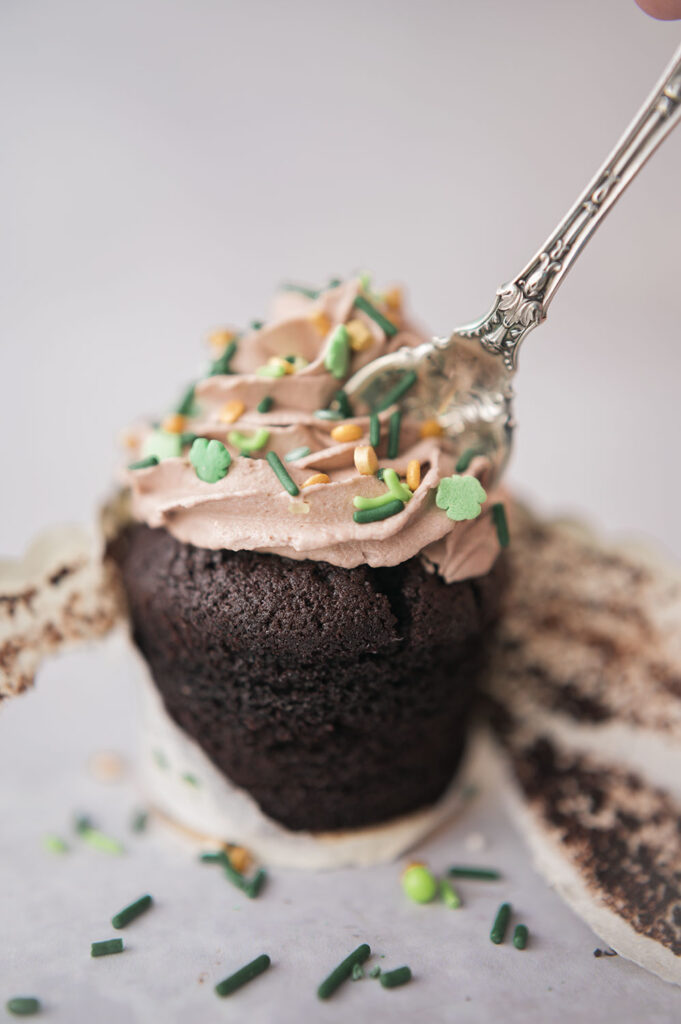 a fancy fork in a chocolate cupcake