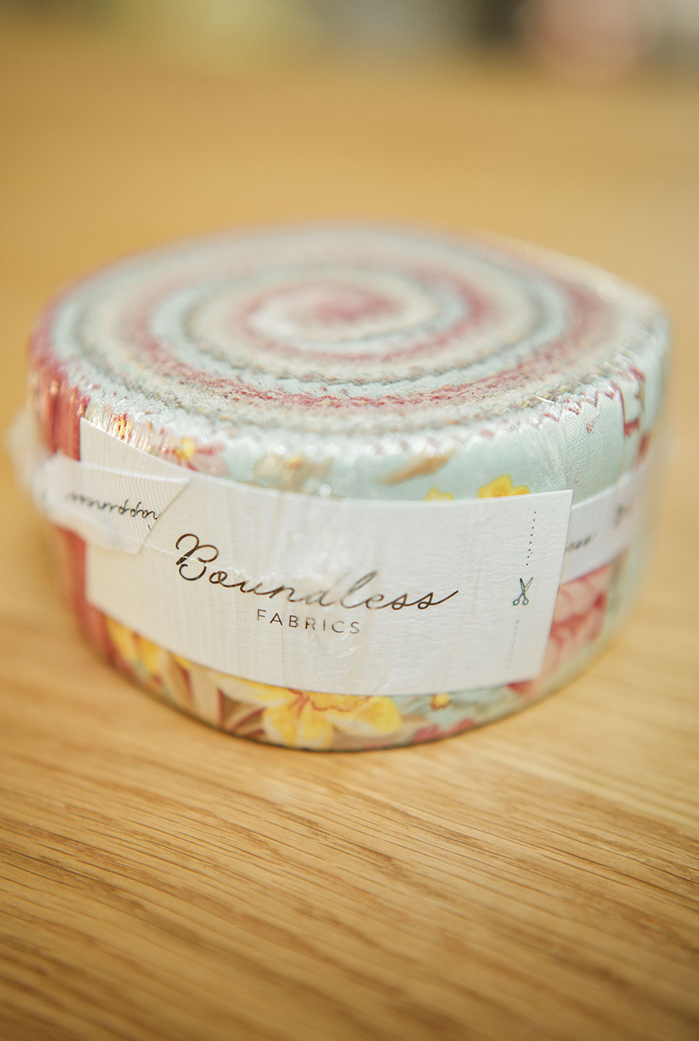 a jelly roll fabric package in pastle colors