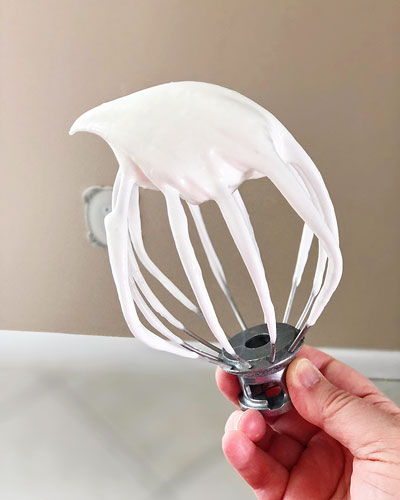 a meringue batter on a wire whip