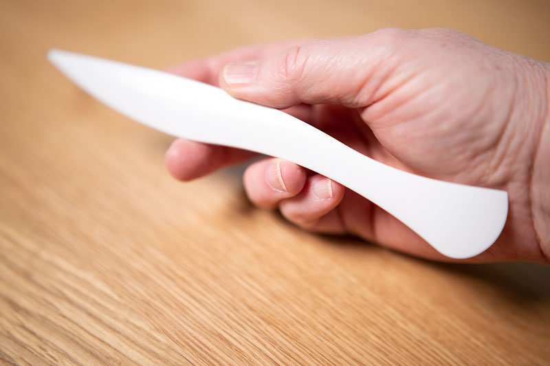 hand holding a clover point turner tool