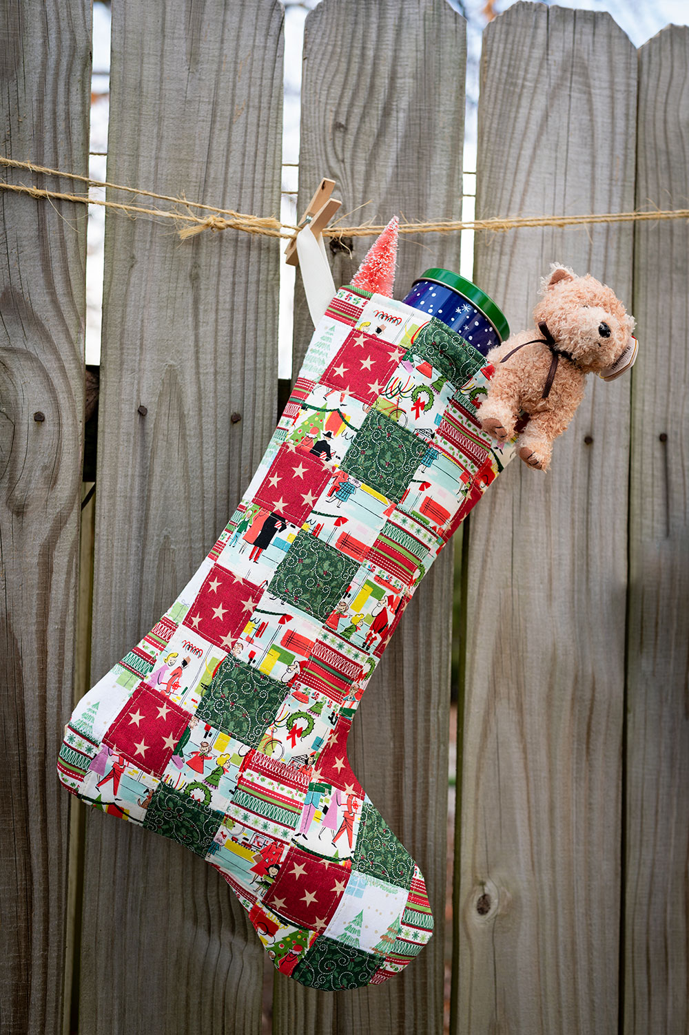 a patchwork stocking with toys peeking out the top
