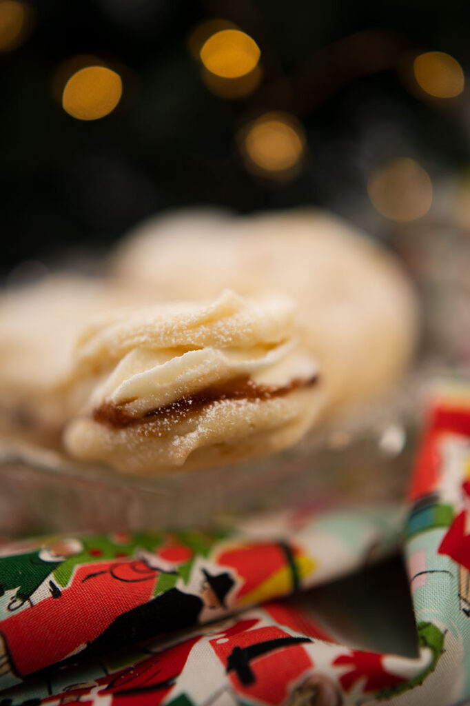 a sandwich cookie filled with jam and frosting