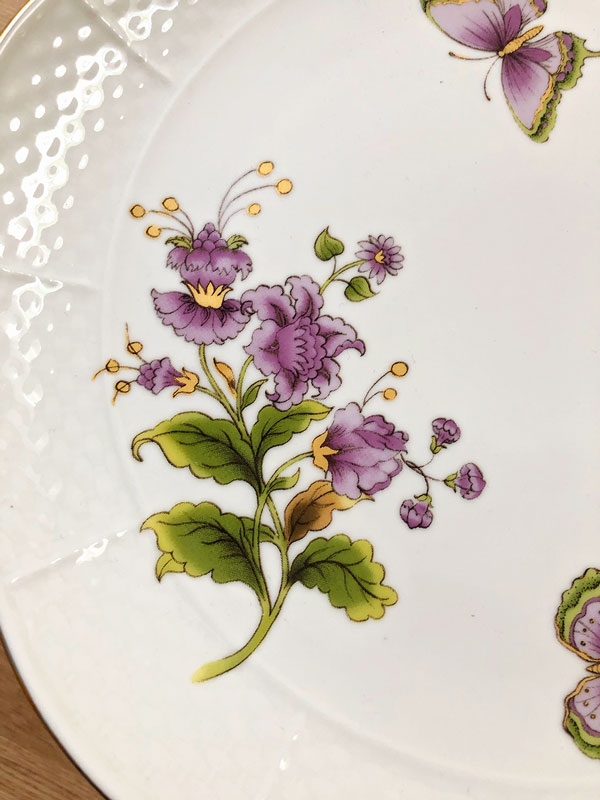 closeup of over head view of cake plate showing orange, violet and green
