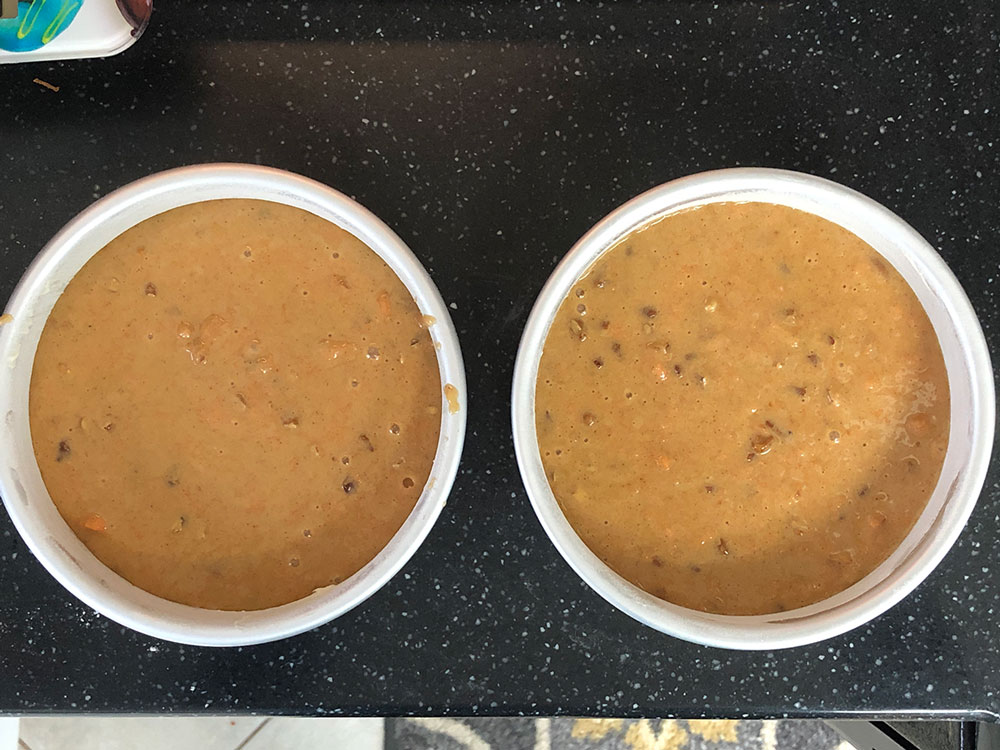 overhead picture of cake batter in pans