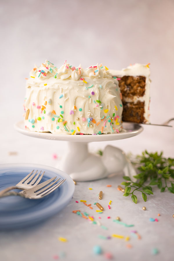 removing a big slice from a carrot cake