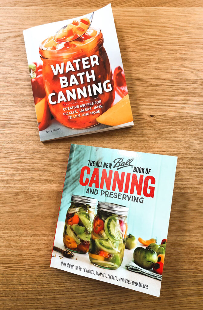 over head picture of two recipe books for canning