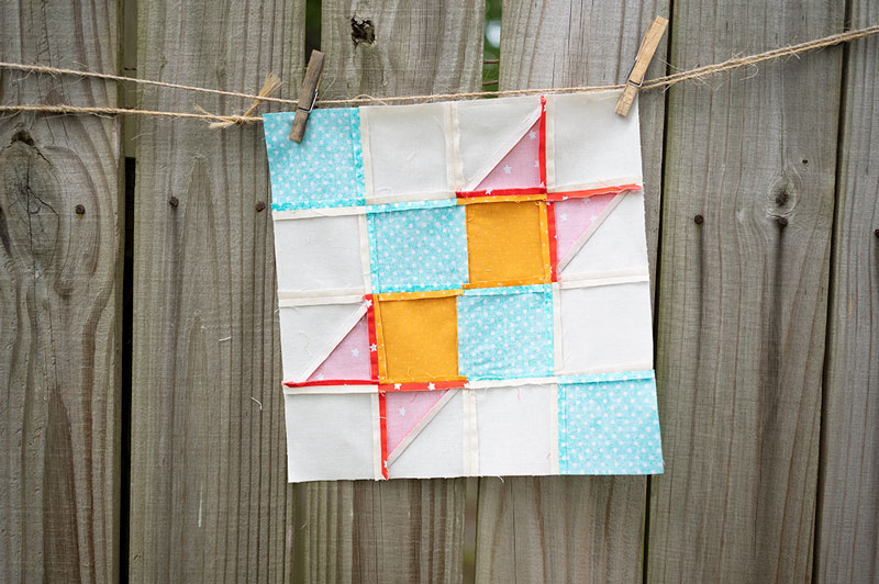 wrong side of a quilt block showing the seams