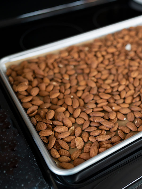 a tray of almonds on a sheet pan