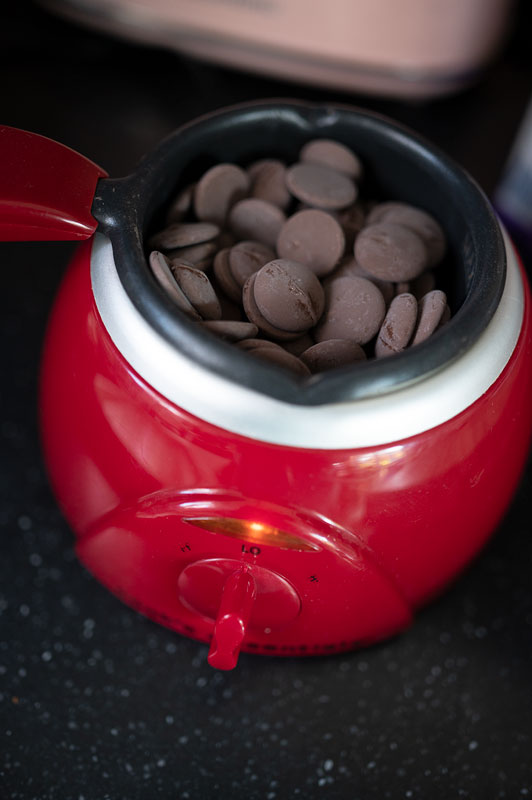 chocolate wafers in an electric chocolate pot