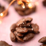 chocolate nut clusters on a pink background