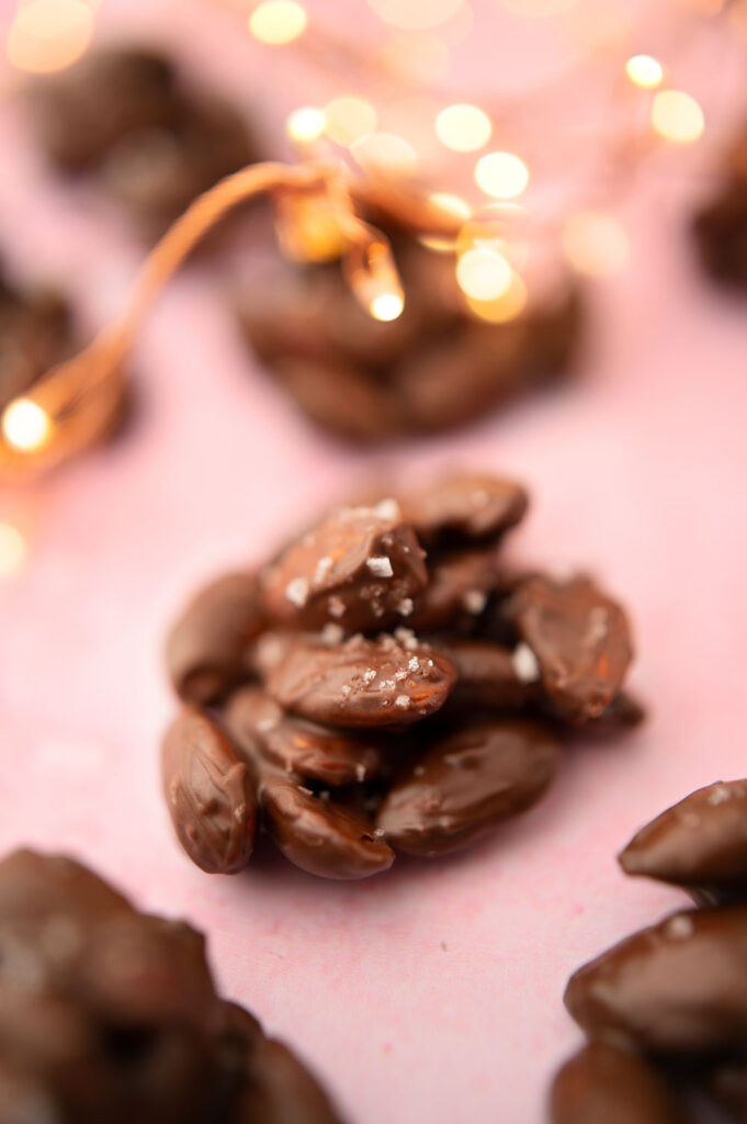 chocolate nut clusters on a pink background