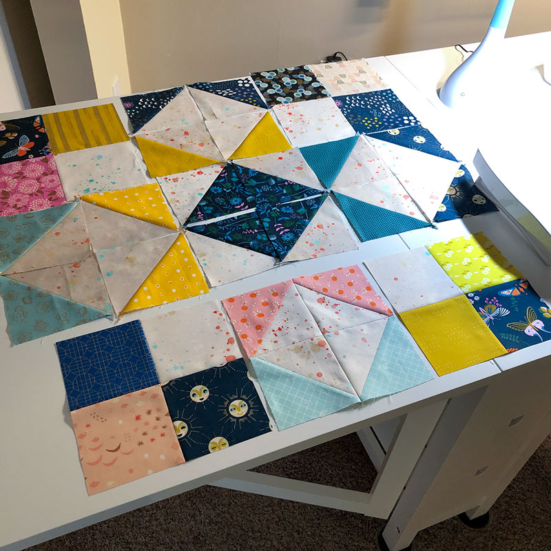 quilt blocks laid in order and ready to sew together