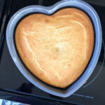 heart shaped cake cooling in the pan