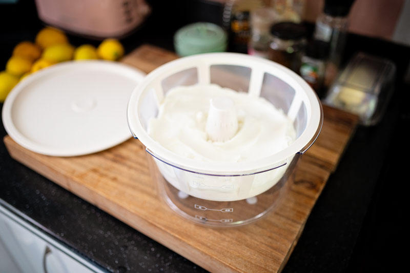 yogurt in a strainer set up to thicken the product