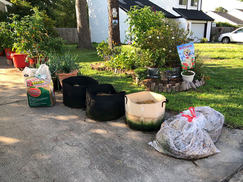 grow bags set up in a driveway