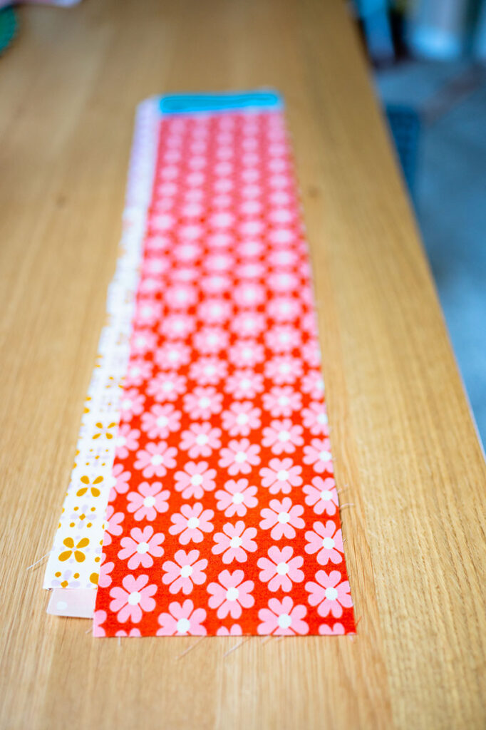 a long strip of red quilting cotton cut 5" wide