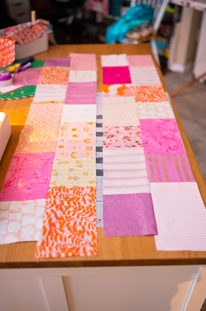colorful rows of patchwork fabric ready for quilting