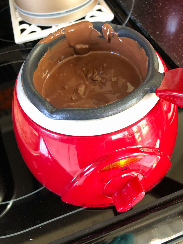 a chocolate pot with melted milk chocolate