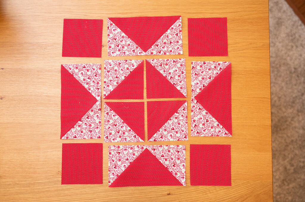 pieces for a sawtooth star quilt block ready for construction