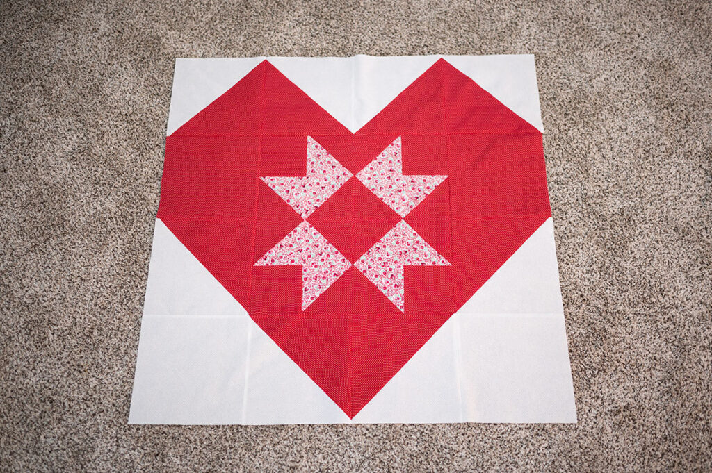 heart quilt block with a sawtooth star center panel