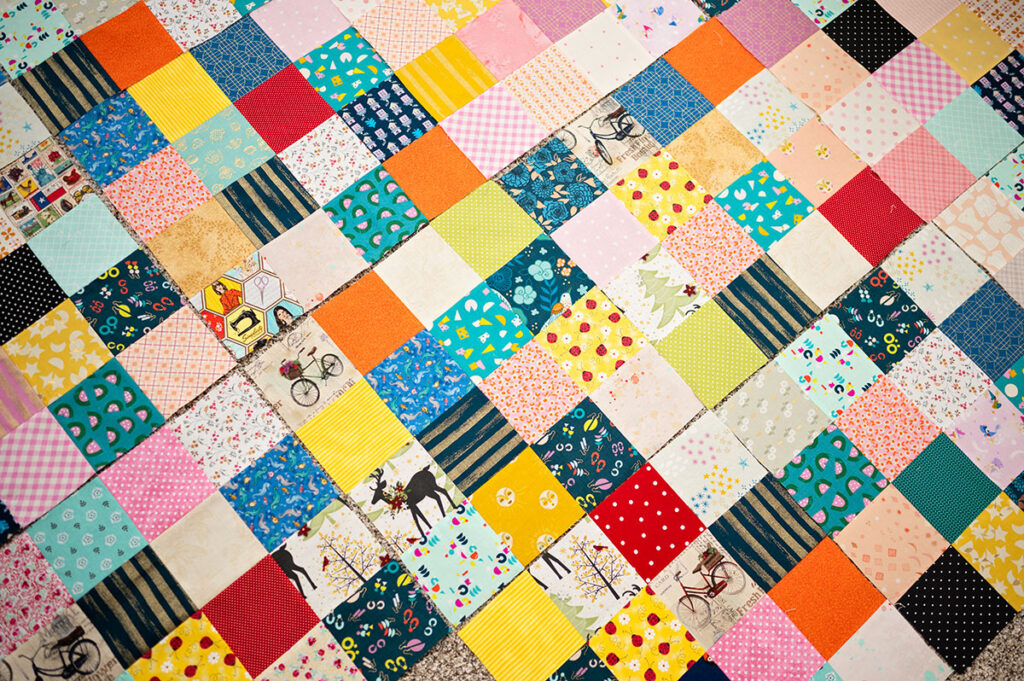 several scrappy quilt blocks placed together