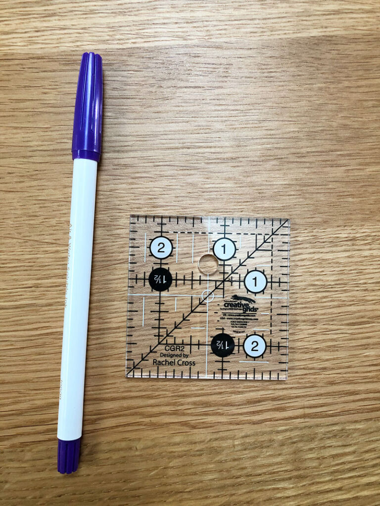 pen and 2.5" quilting ruler