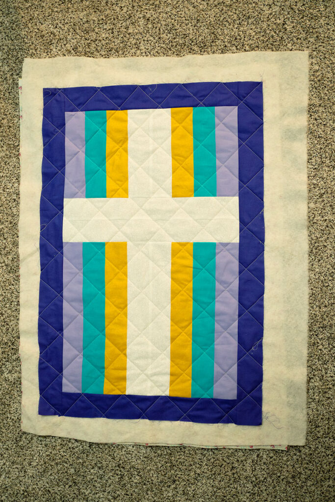 a quilted cross ready for finishing