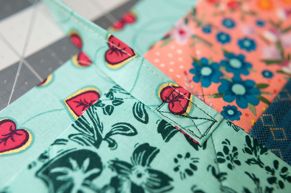 box with an x shape sewn to secure straps