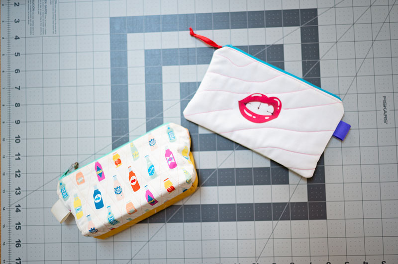 two bag projects on a cutting mat