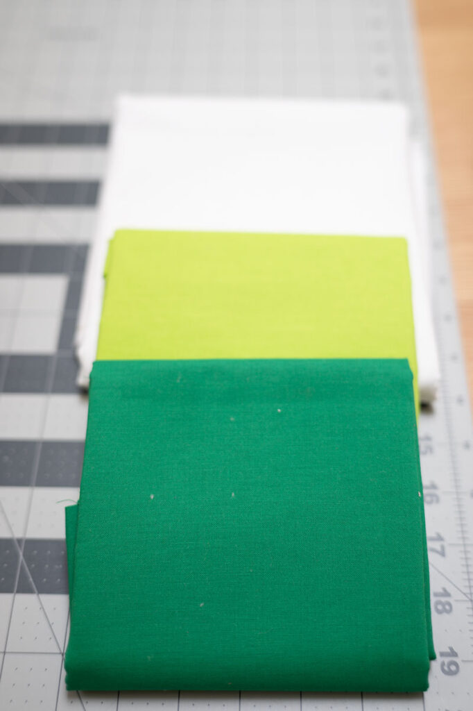 solid color fabrics in three folded cuts of yardage